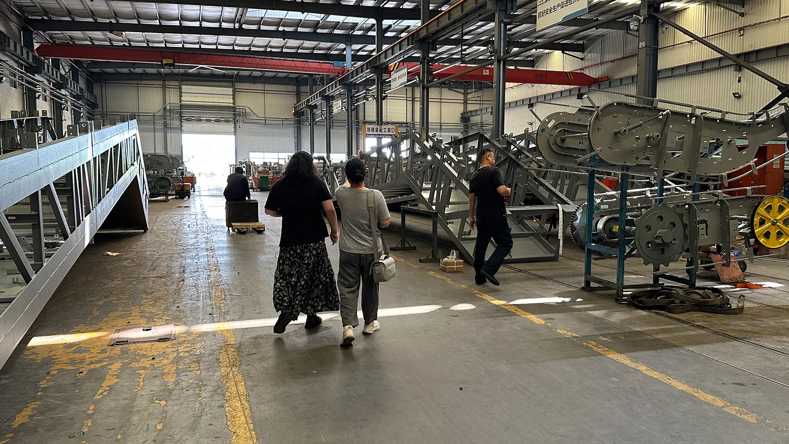 A third party sourcing agent from SourceEyes walking the production floor of a supplier factory in China